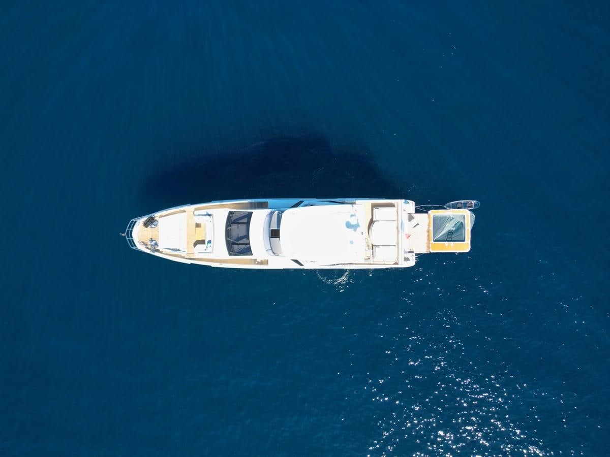 a small white boat in the water aboard GRANDE 27M Yacht for Sale