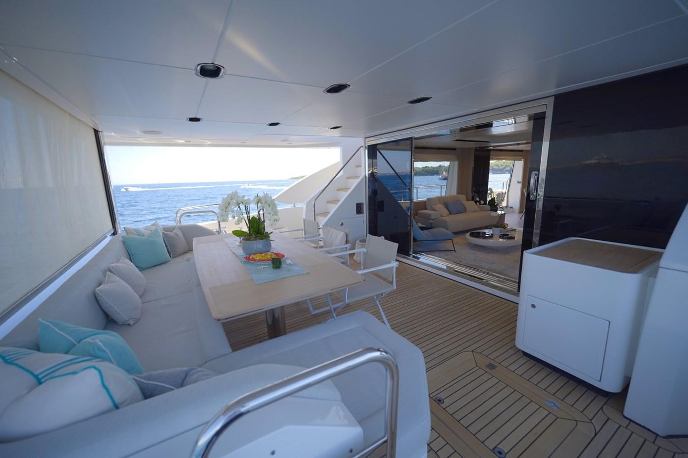 a living room with a large window aboard GRANDE 27M Yacht for Sale