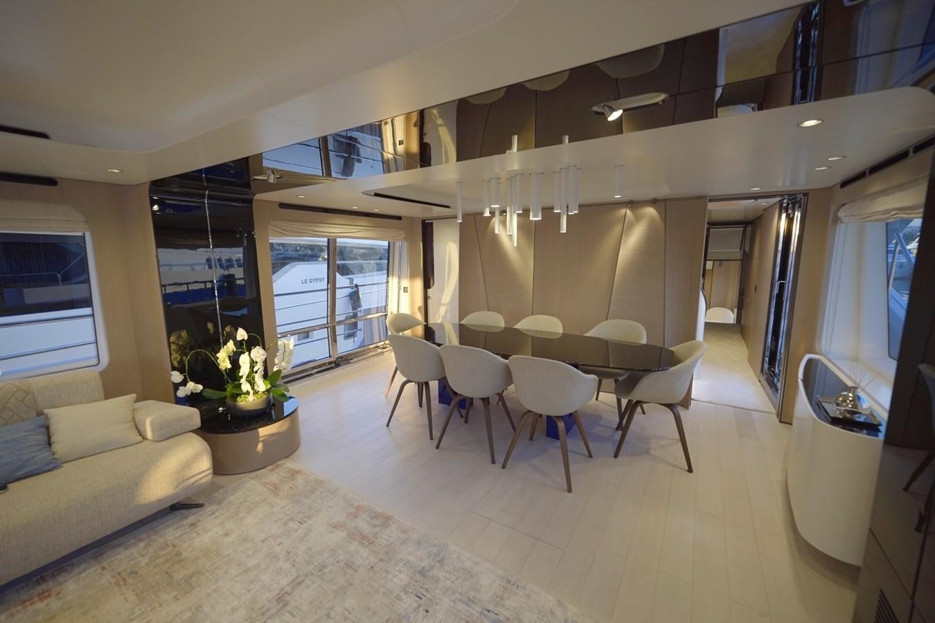 a living room with a couch and a table aboard GRANDE 27M Yacht for Sale