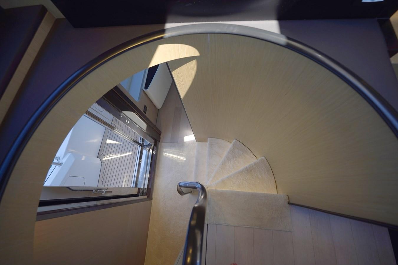 a staircase with a glass railing aboard GRANDE 27M Yacht for Sale