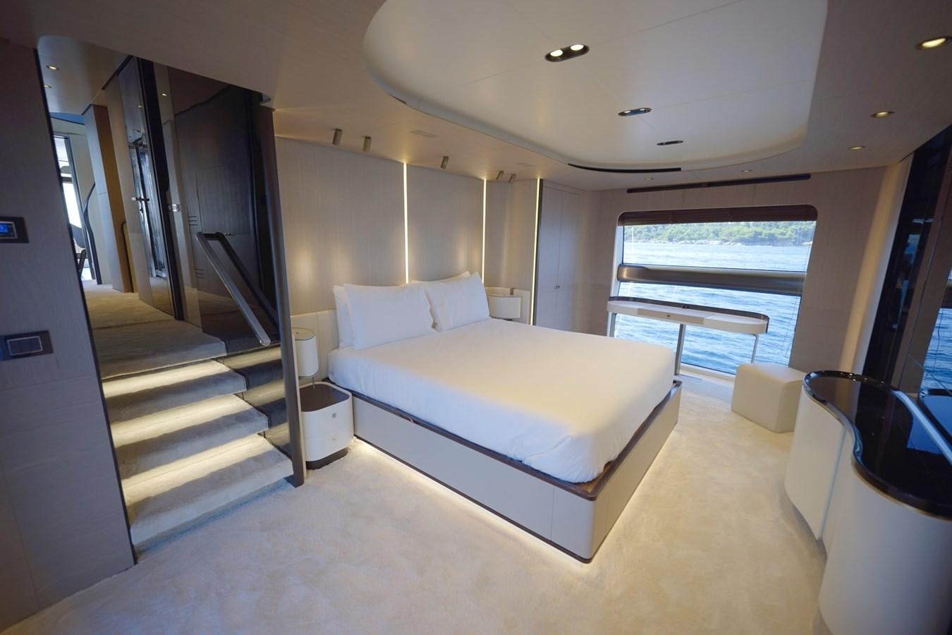 a room with a bed and a staircase aboard GRANDE 27M Yacht for Sale