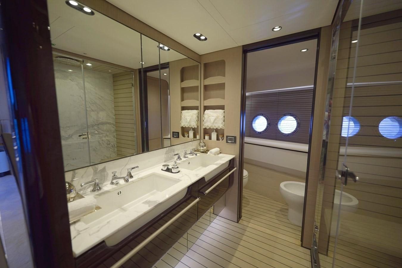 a bathroom with a large mirror aboard GRANDE 27M Yacht for Sale