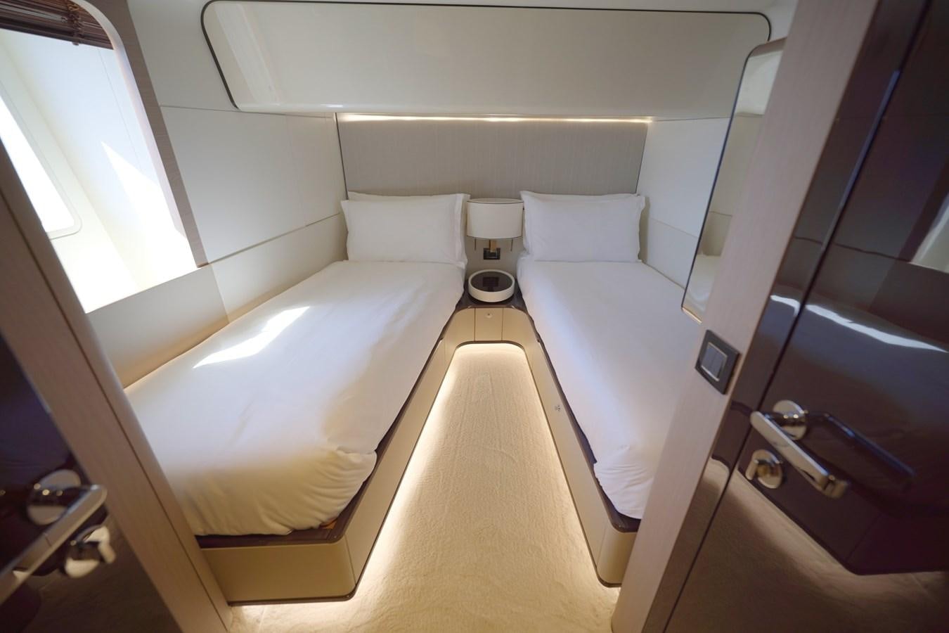 a room with a bed and a window aboard GRANDE 27M Yacht for Sale