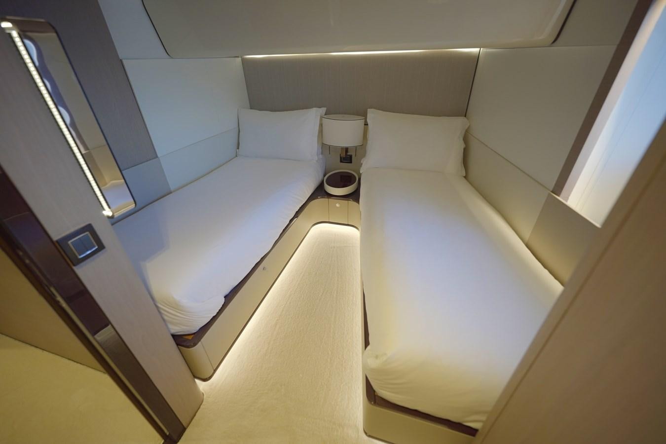 a room with a bed and a window aboard GRANDE 27M Yacht for Sale