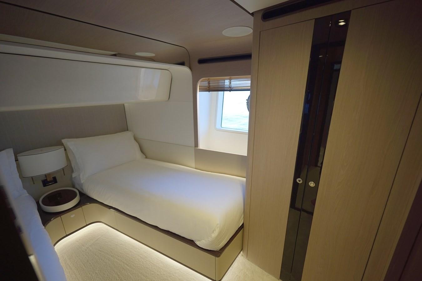 a room with a bed and a window aboard GRANDE 27M Yacht for Sale