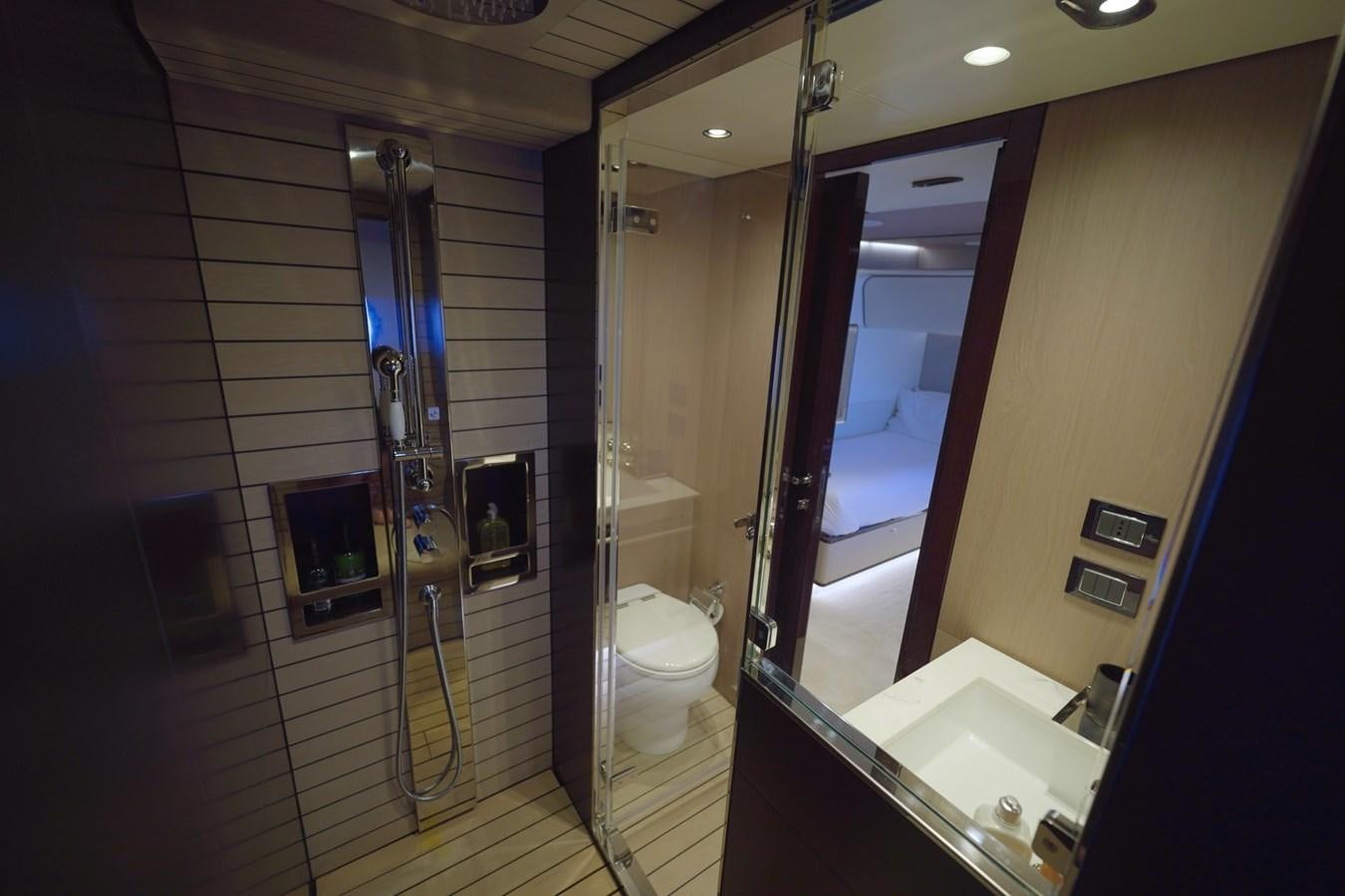 a bathroom with a glass shower aboard GRANDE 27M Yacht for Sale