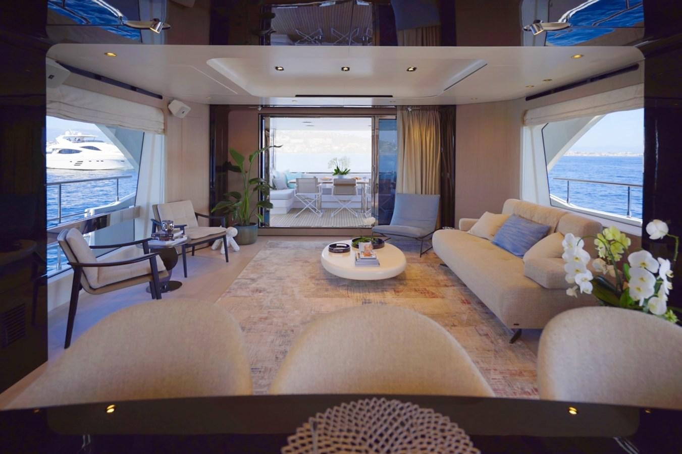 a living room with a large window aboard GRANDE 27M Yacht for Sale