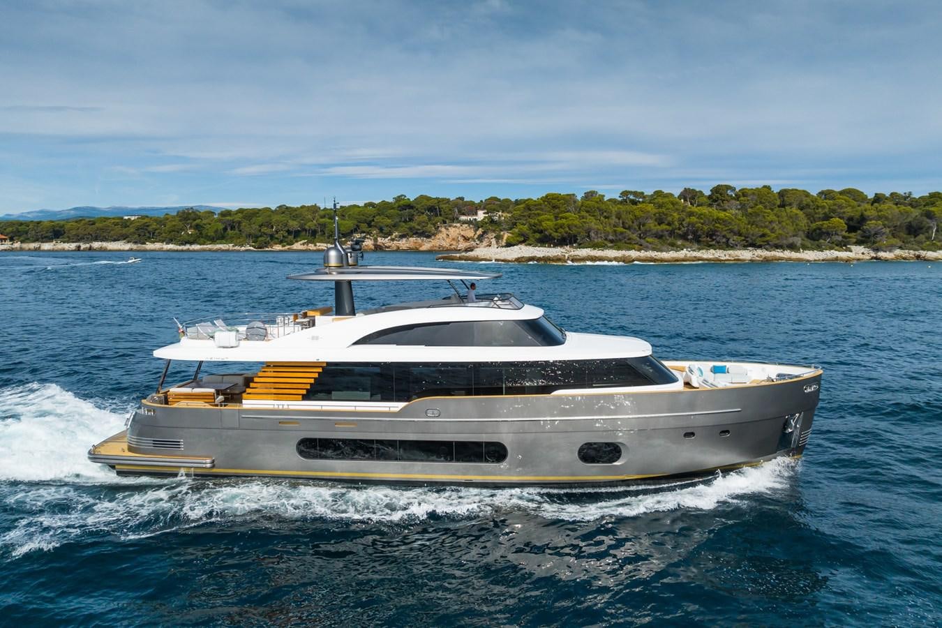 a white boat on water aboard SWG Yacht for Sale