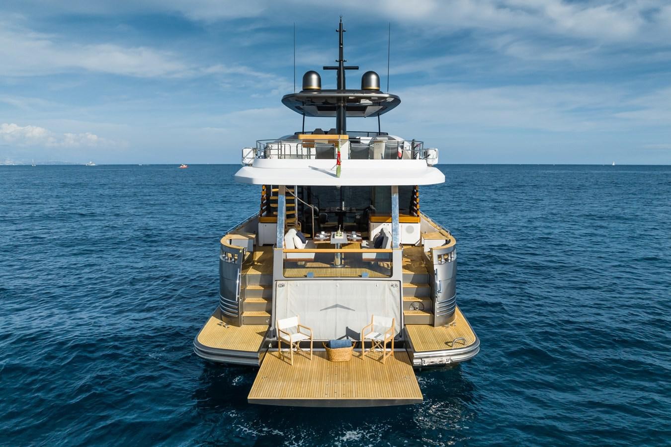 a yellow and white boat in the water aboard SWG Yacht for Sale