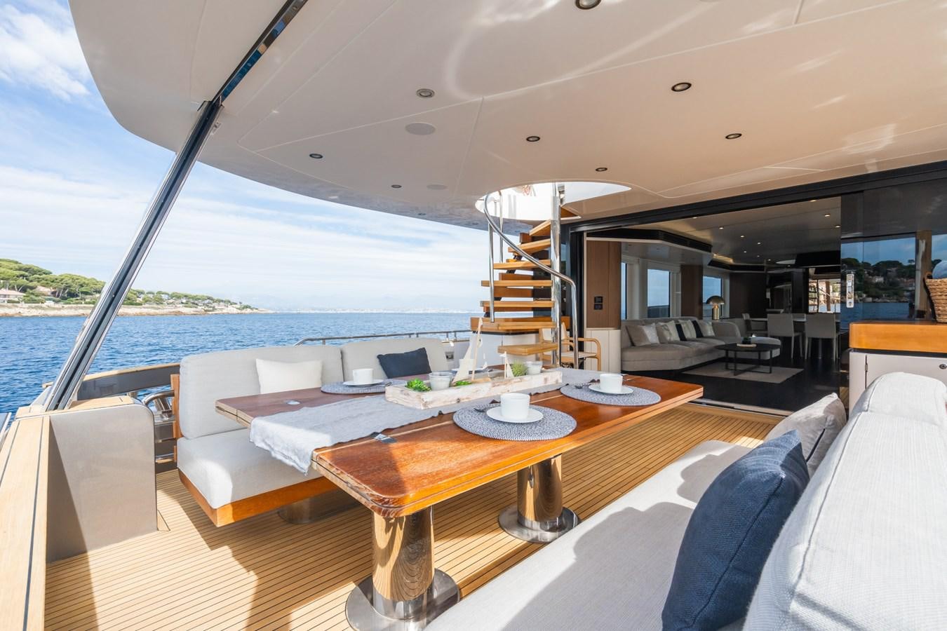 a boat with a table and chairs aboard SWG Yacht for Sale