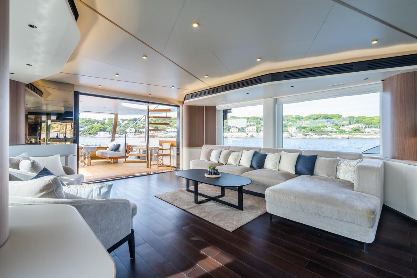 a living room with a large window aboard SWG Yacht for Sale