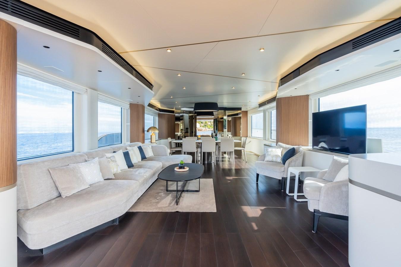 a living room with a large window aboard SWG Yacht for Sale