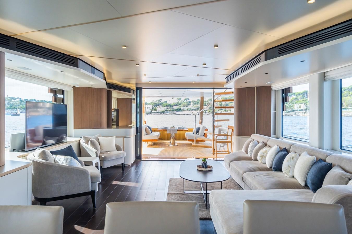 a living room with a large window aboard SWG Yacht for Sale
