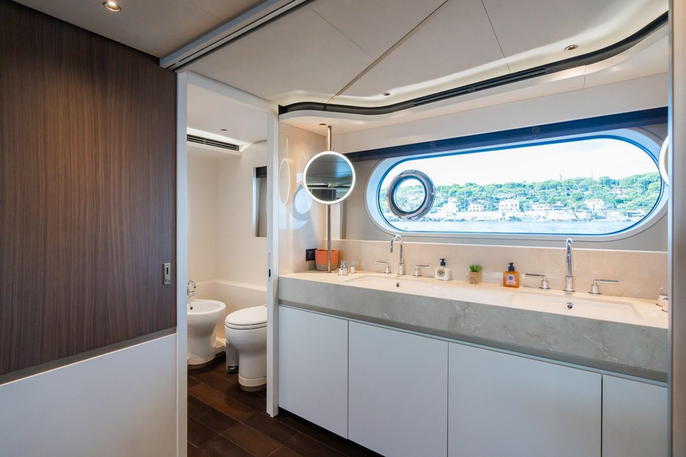 a bathroom with a large window aboard SWG Yacht for Sale