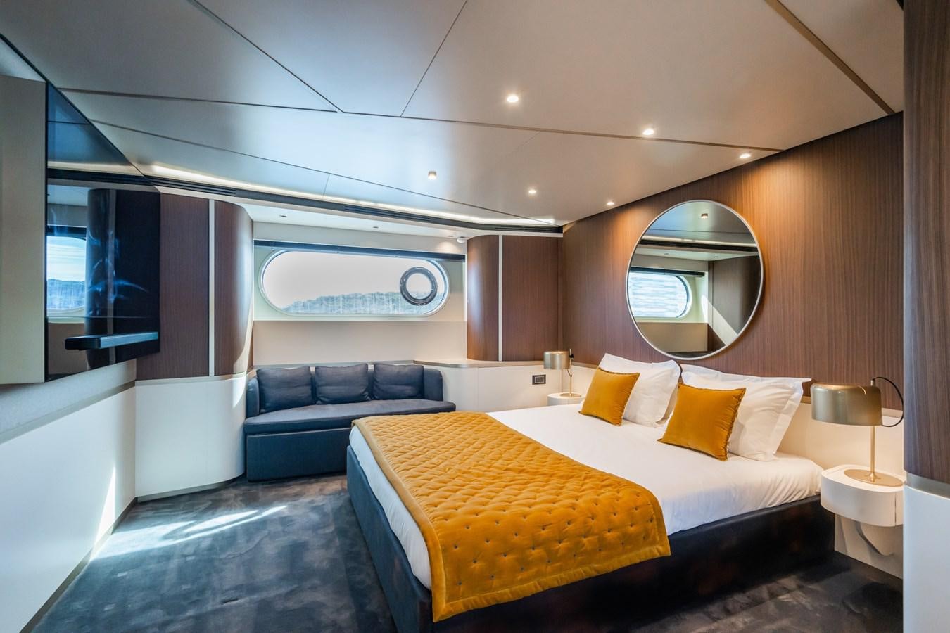 a room with a bed and a couch aboard SWG Yacht for Sale