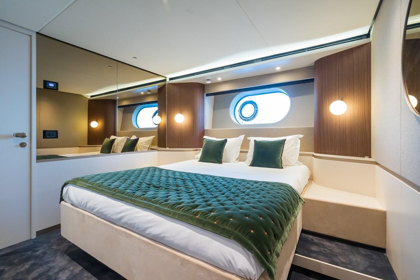 a room with a bed and a window aboard SWG Yacht for Sale