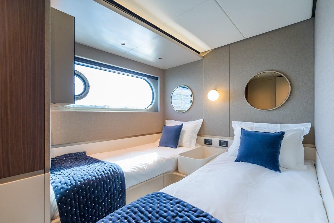 a room with two beds aboard SWG Yacht for Sale