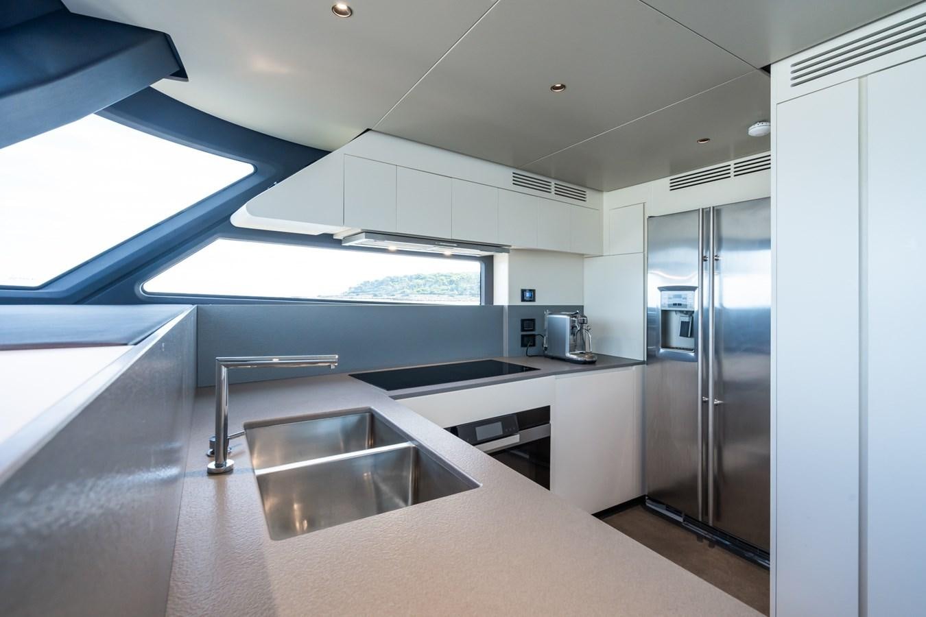 a kitchen with a large island aboard SWG Yacht for Sale