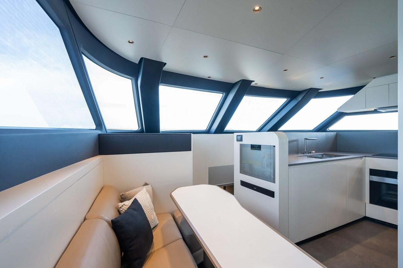 a room with a couch and a table aboard SWG Yacht for Sale