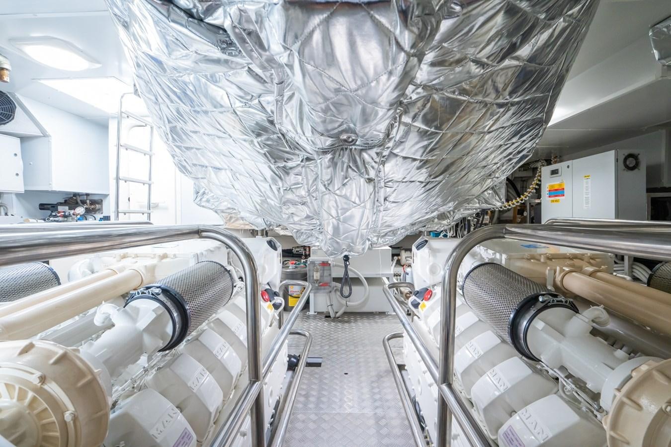a large white room with pipes and tubes aboard SWG Yacht for Sale