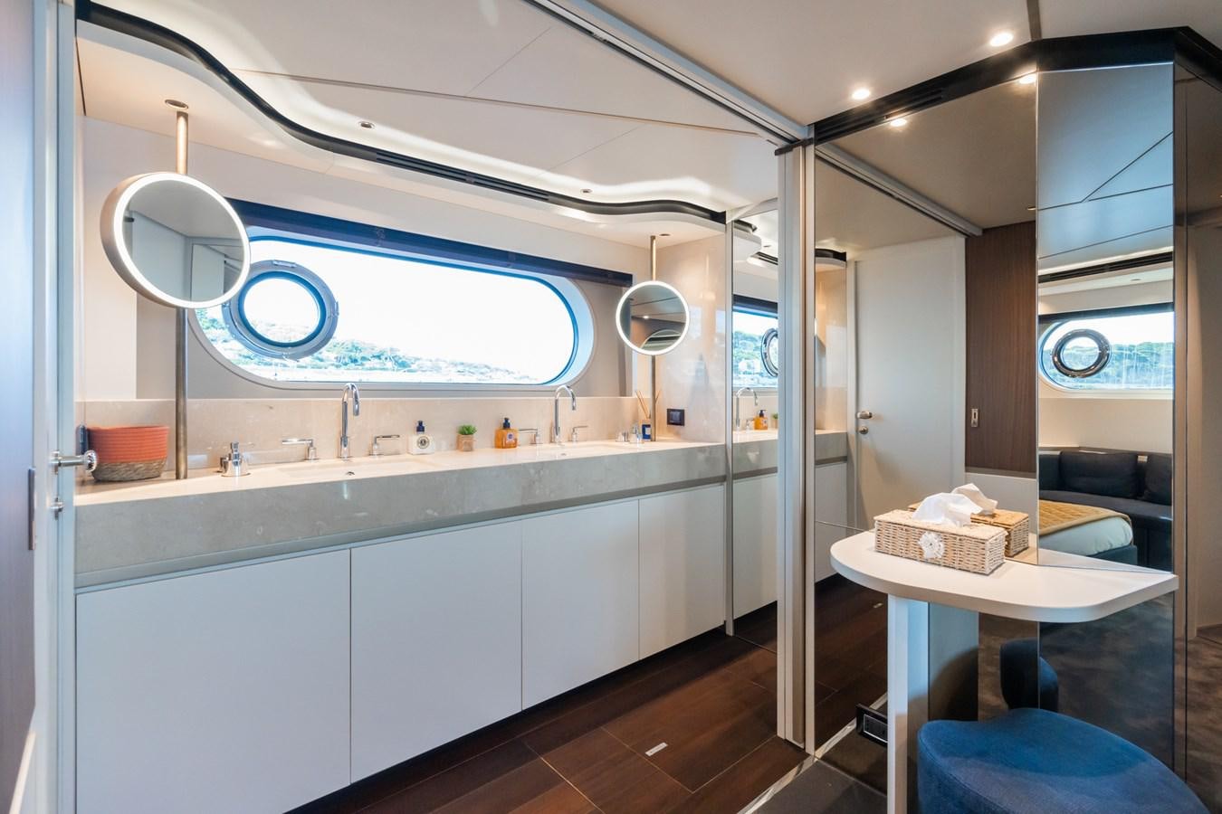 a kitchen with a table and a window aboard SWG Yacht for Sale