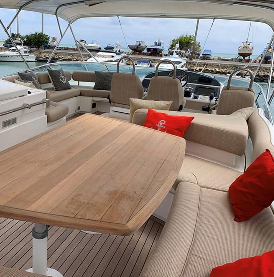 a boat with a table and chairs aboard OCEANA Yacht for Sale