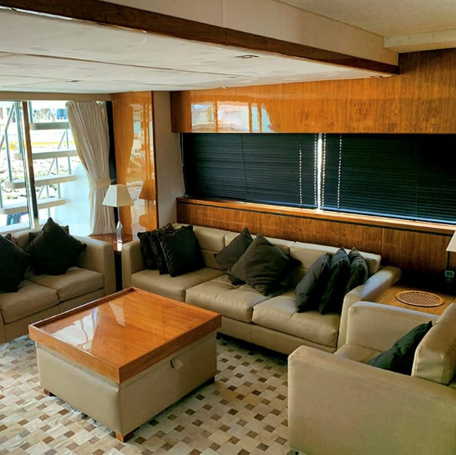 a living room with a couch and a coffee table aboard OCEANA Yacht for Sale