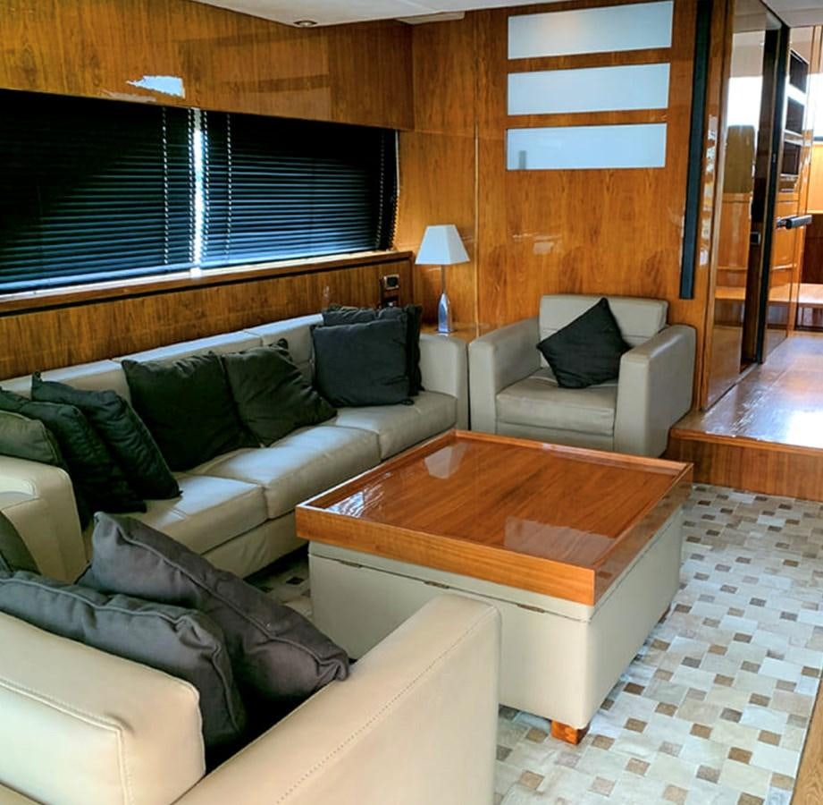a living room with a couch and a coffee table aboard OCEANA Yacht for Sale