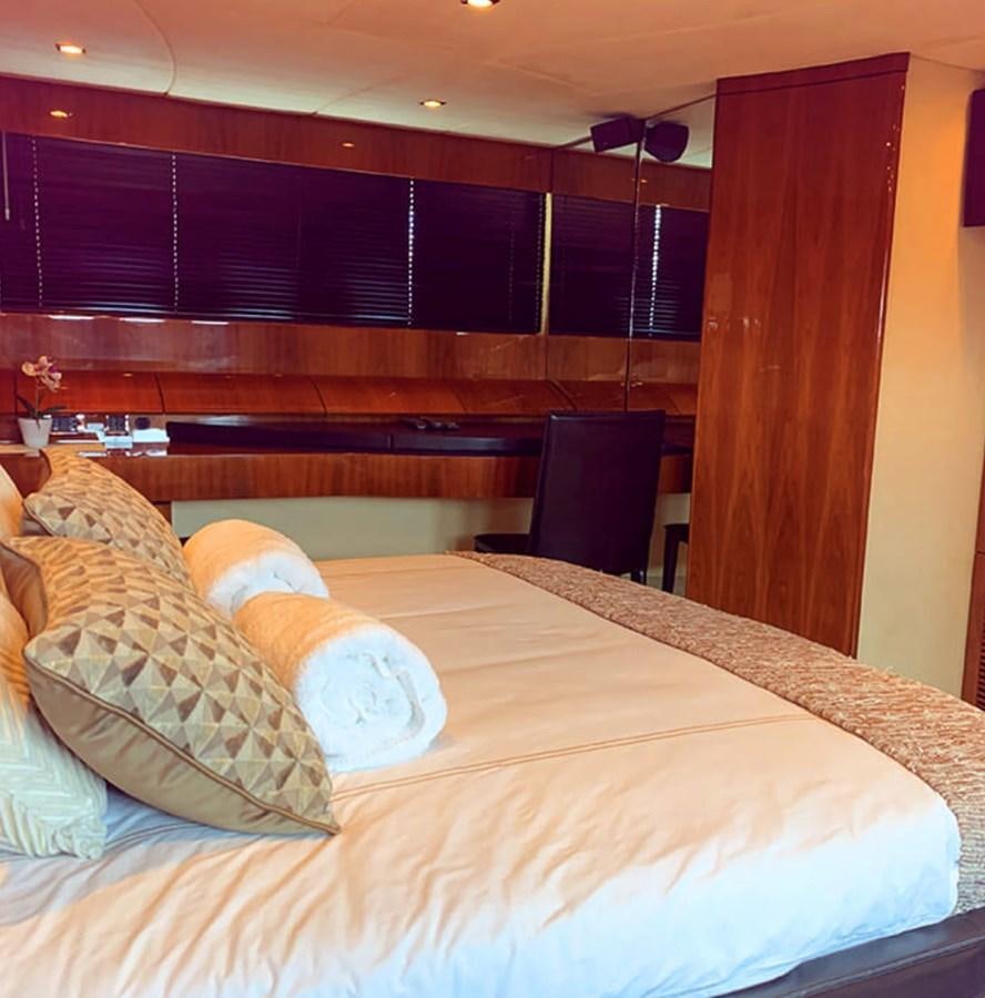 a bed with a pillow aboard OCEANA Yacht for Sale