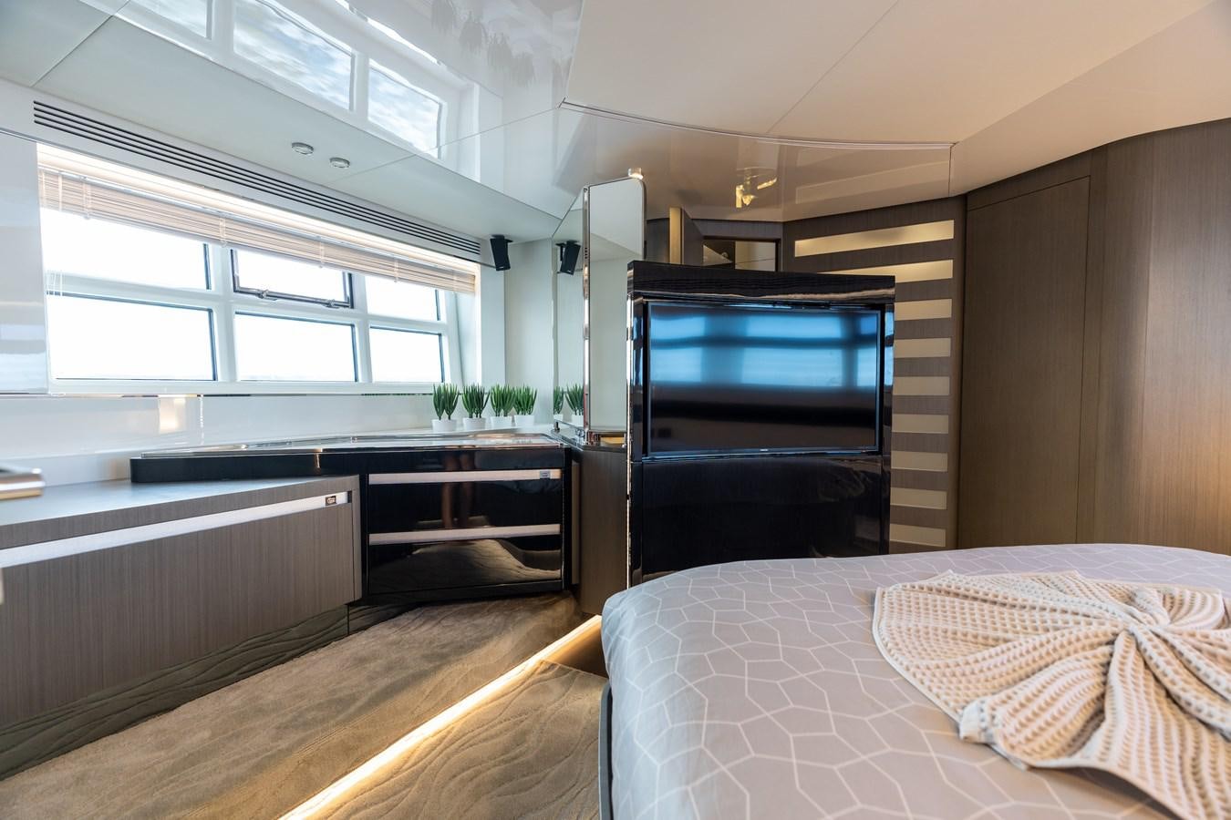 a room with a bed and a television aboard ZERO DIMENSION Yacht for Sale