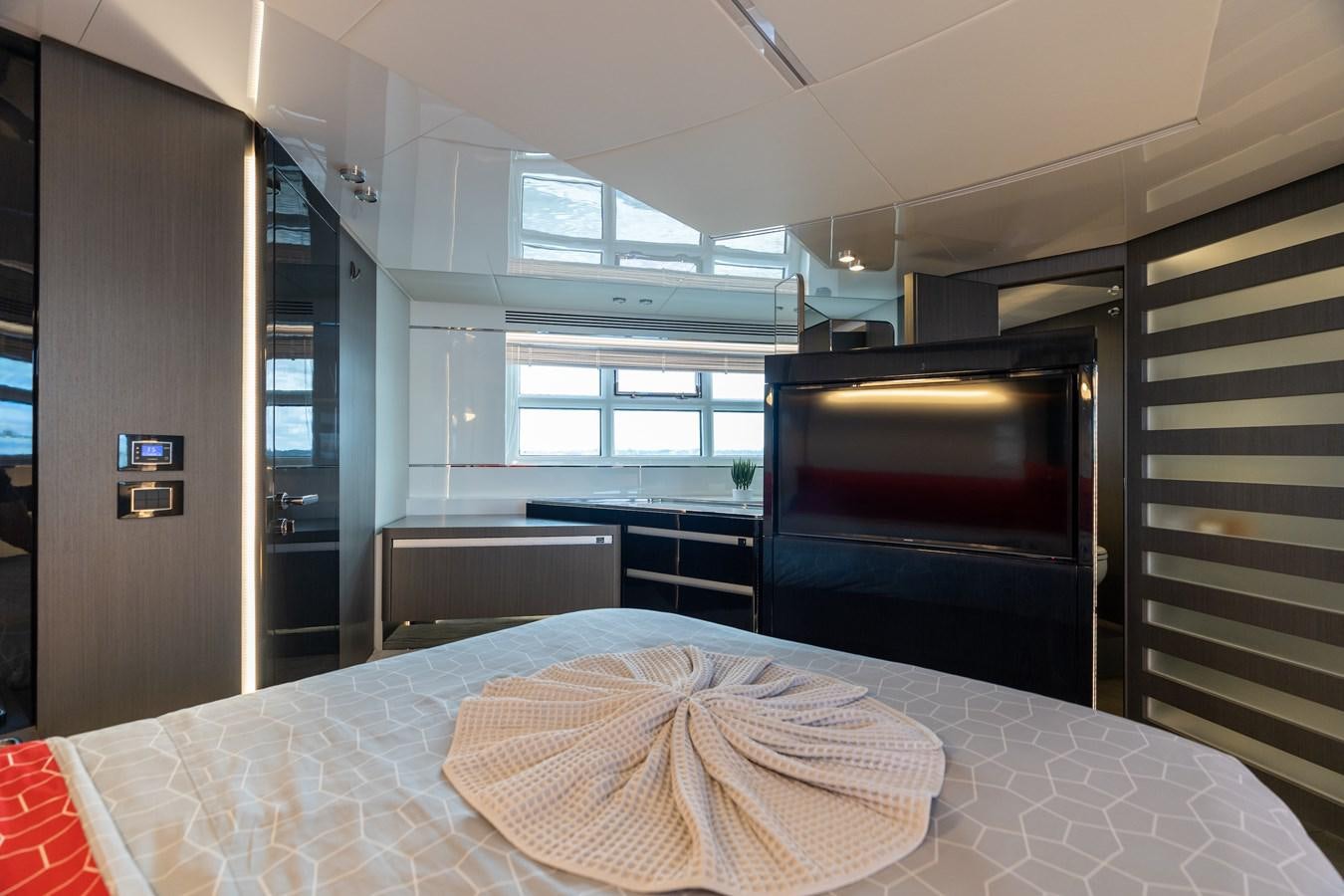 a room with a bed and a table aboard ZERO DIMENSION Yacht for Sale