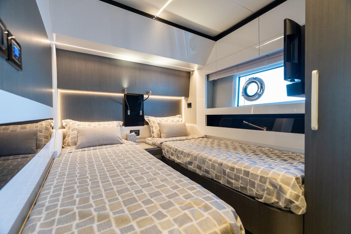 a room with two beds aboard ZERO DIMENSION Yacht for Sale