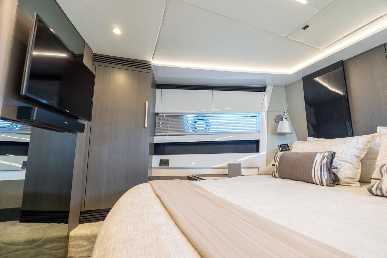 a bedroom with a bed and a tv aboard ZERO DIMENSION Yacht for Sale
