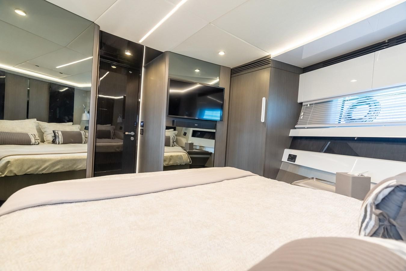 a room with a bed and a large window aboard ZERO DIMENSION Yacht for Sale