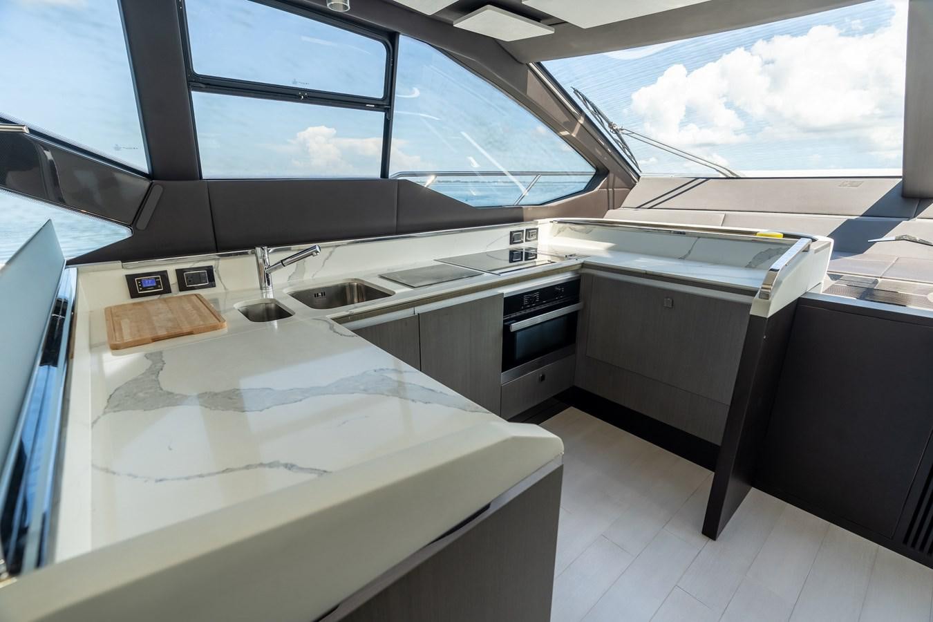 a large white kitchen with a large window aboard ZERO DIMENSION Yacht for Sale