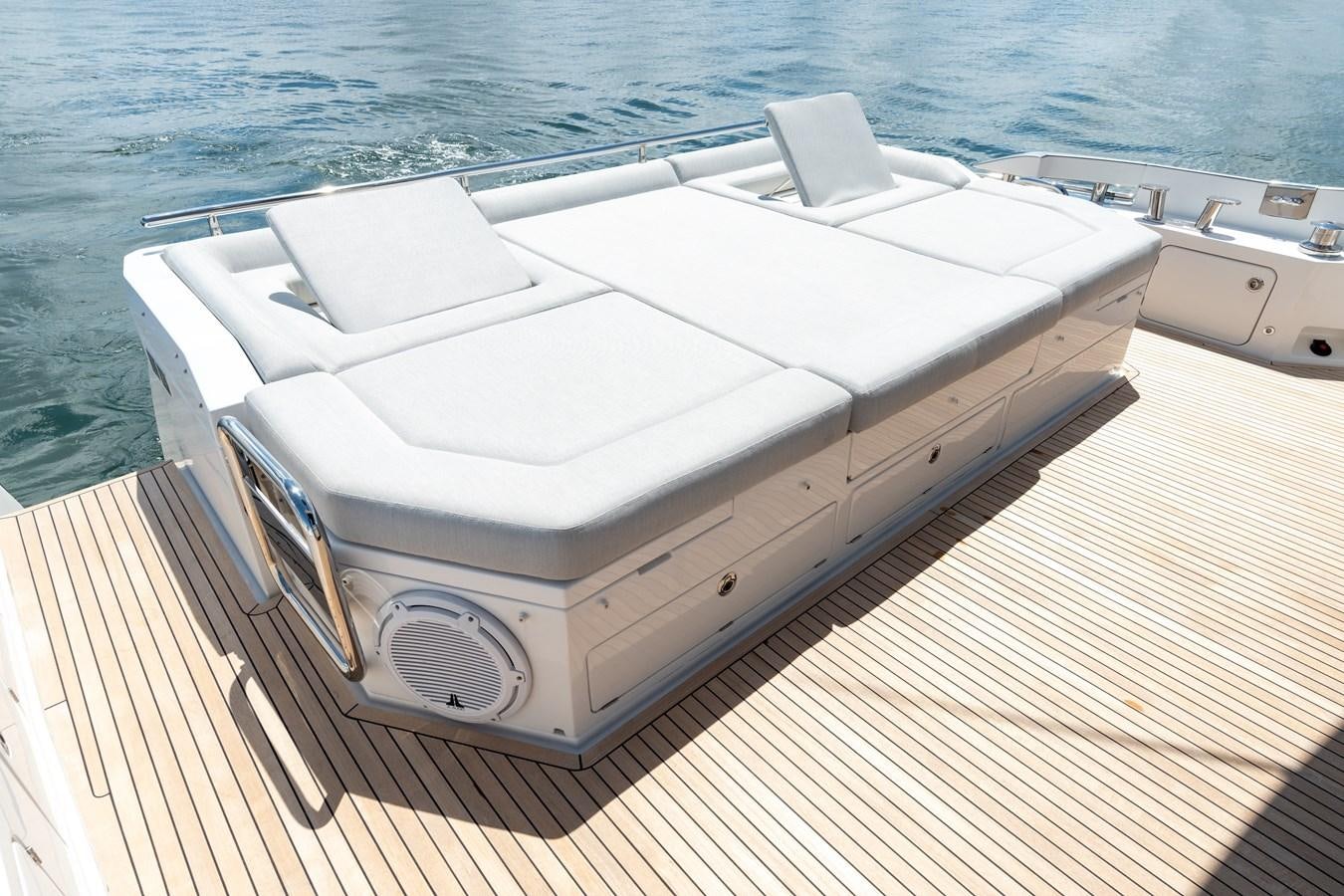 a white boat on a deck aboard ZERO DIMENSION Yacht for Sale