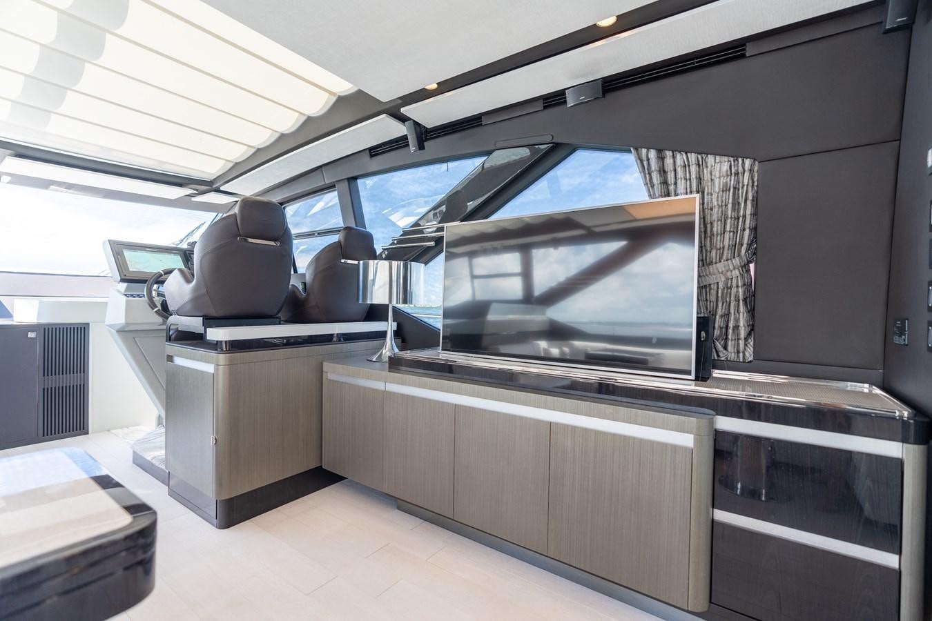 a room with a large screen aboard ZERO DIMENSION Yacht for Sale