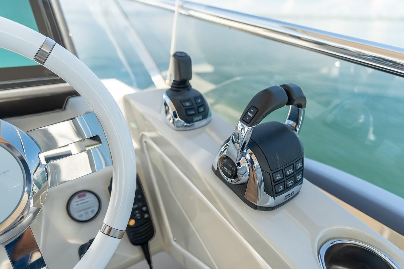 a close-up of a steering wheel aboard ZERO DIMENSION Yacht for Sale