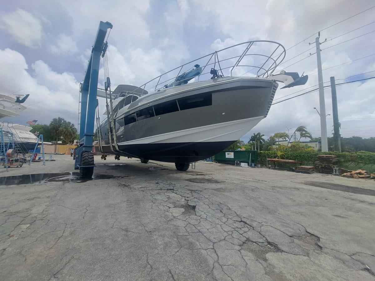 a helicopter parked on a concrete surface aboard ZERO DIMENSION Yacht for Sale