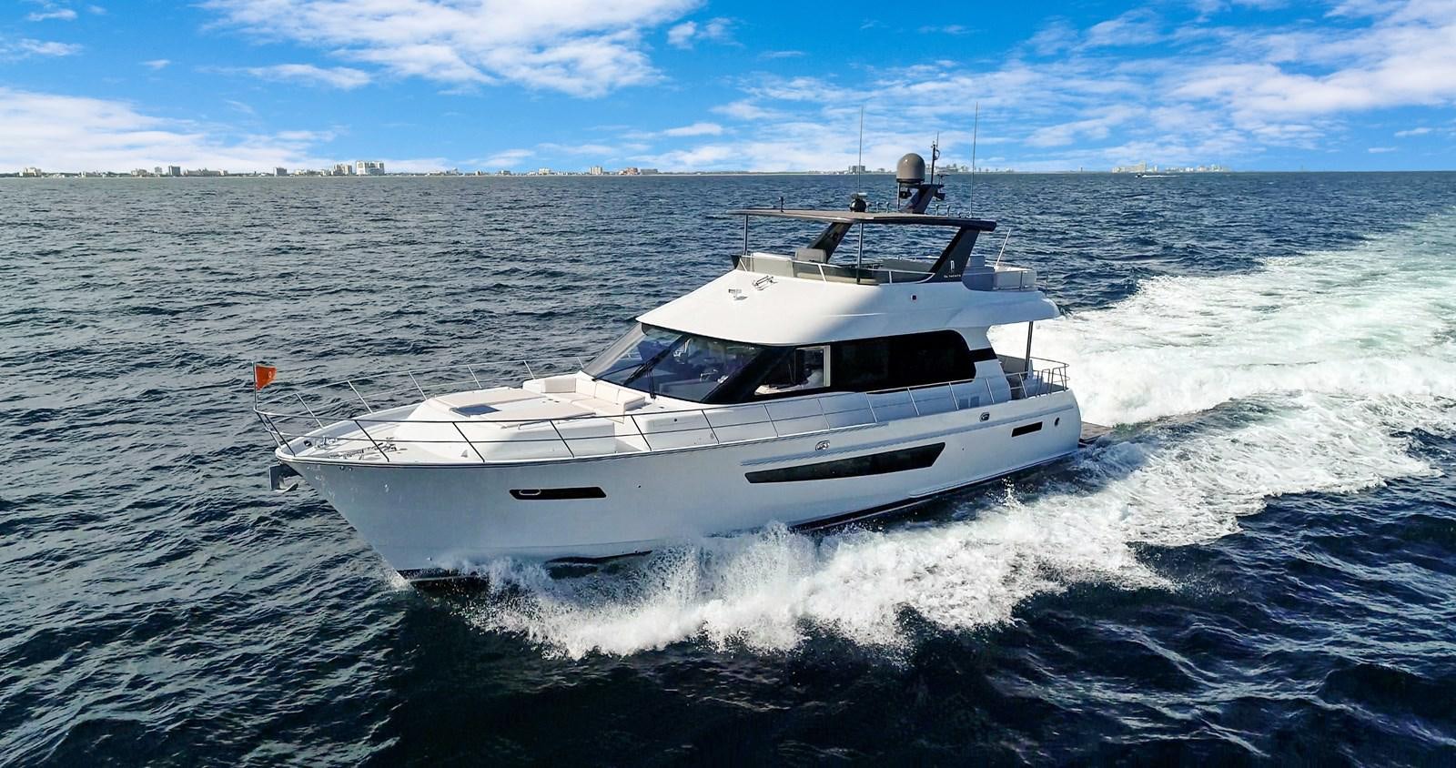 a white yacht on the water aboard CLB65 Yacht for Sale