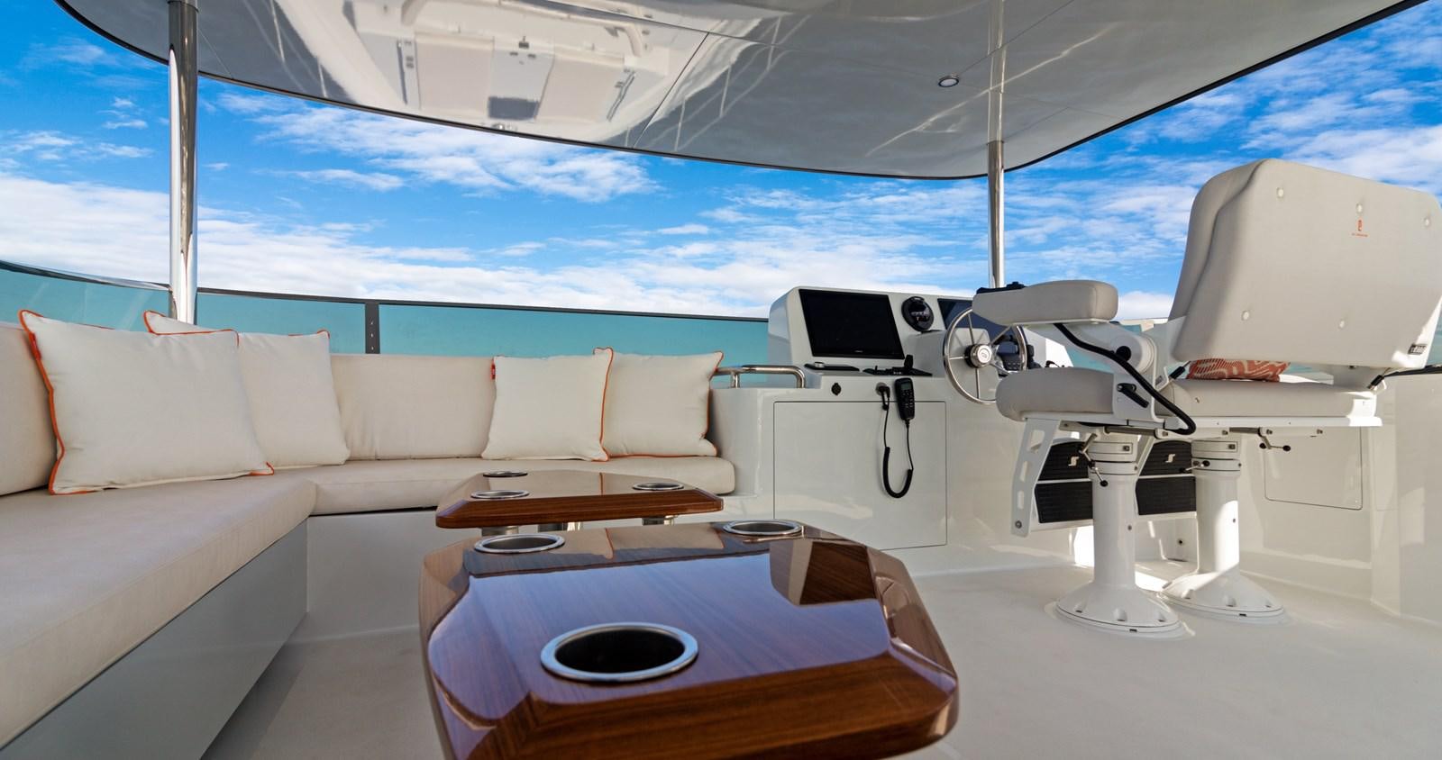 a white tent with a table and a couch aboard CLB65 Yacht for Sale