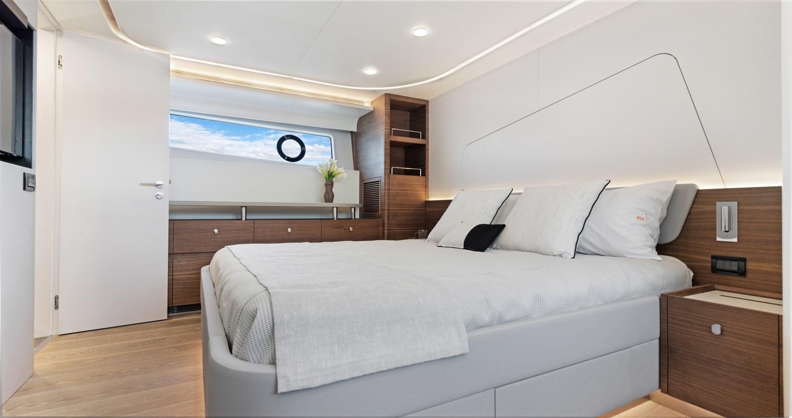 a bed in a room aboard CLB65 Yacht for Sale