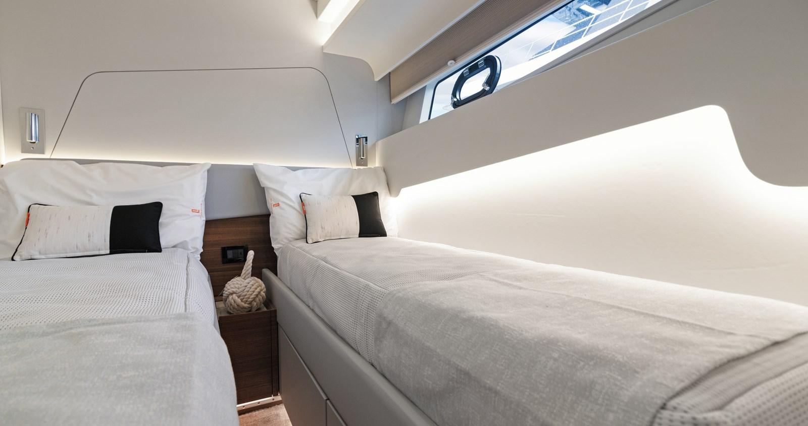 a room with two beds aboard CLB65 Yacht for Sale