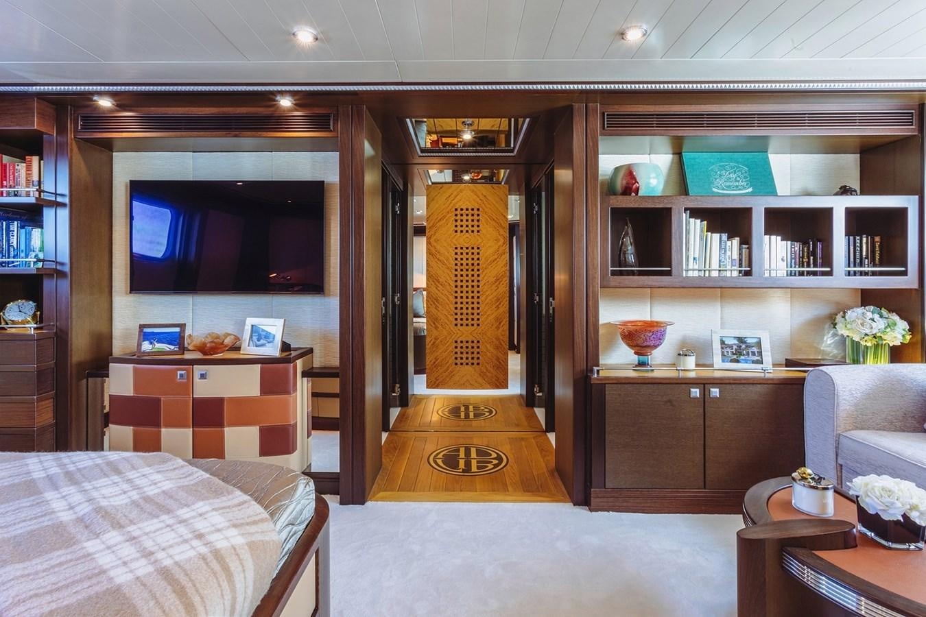 a room with a bed and a closet aboard AD LIB Yacht for Sale