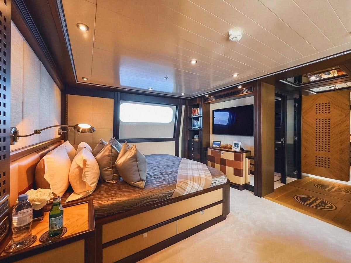 a bed in a room aboard AD LIB Yacht for Sale
