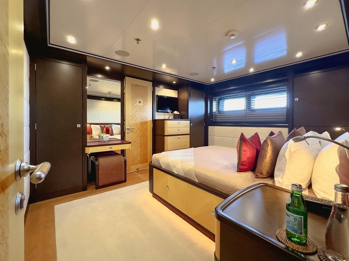 a living room with a couch and a table aboard AD LIB Yacht for Sale