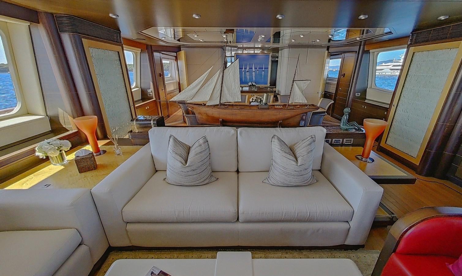 a white couch in a room aboard AD LIB Yacht for Sale