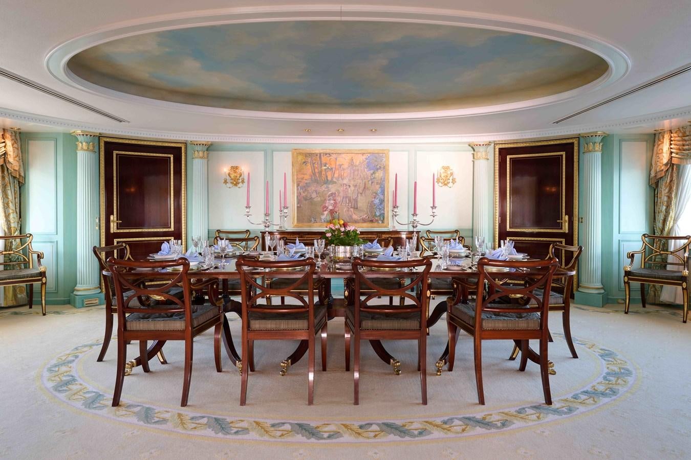 a large dining room with a large table and chairs aboard LADY BEATRICE Yacht for Sale