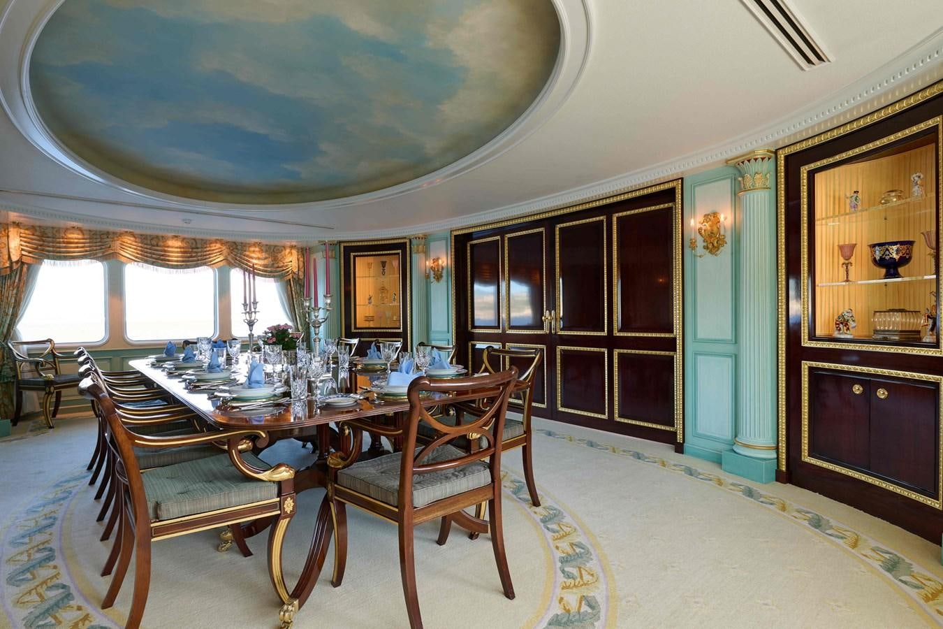 a dining room with a table and chairs aboard LADY BEATRICE Yacht for Sale