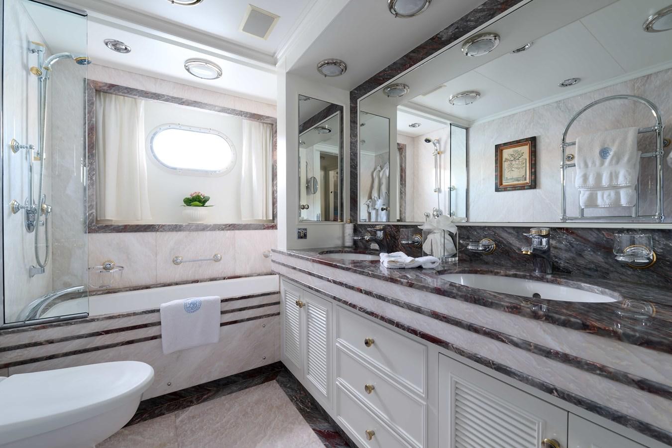 a bathroom with a large mirror aboard LADY BEATRICE Yacht for Sale